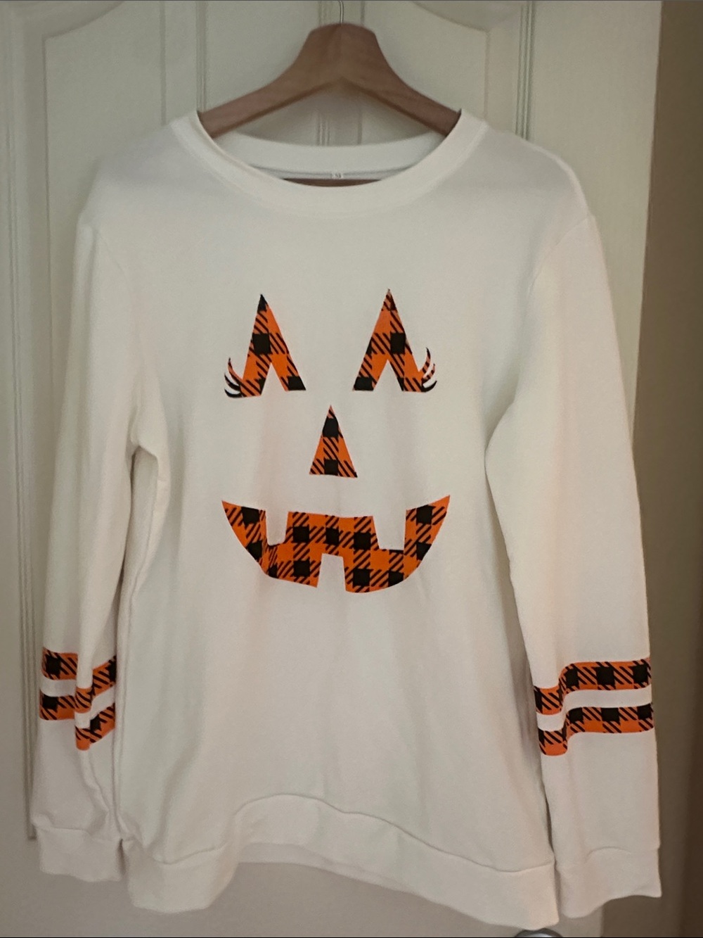 White Pumpkin Face Crewneck Sweatshirt with Orange Plaid Accents